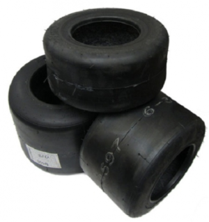 Three stacked Burris Tires - 810 in black, displaying visible tread patterns and slight wear on their surfaces.