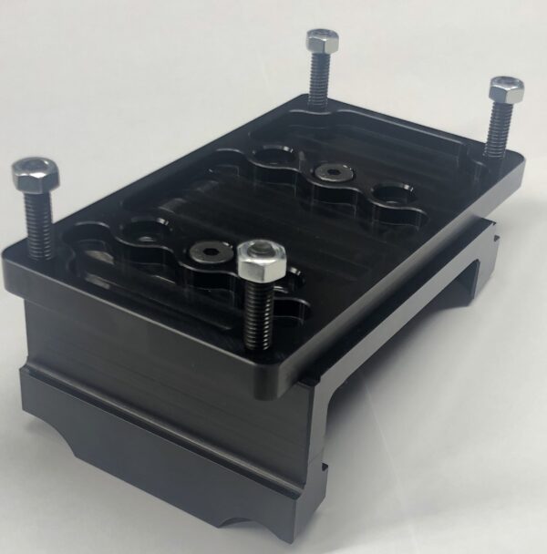 A Motor Mount from International Clamps, featuring a black metal bracket with four protruding bolts and multiple slots, is set against a plain white background. This model is the 8" width with a standard 1/2" plate.
