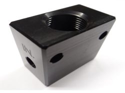 A black, rectangular metal block with a central threaded hole and two smaller holes on each side.